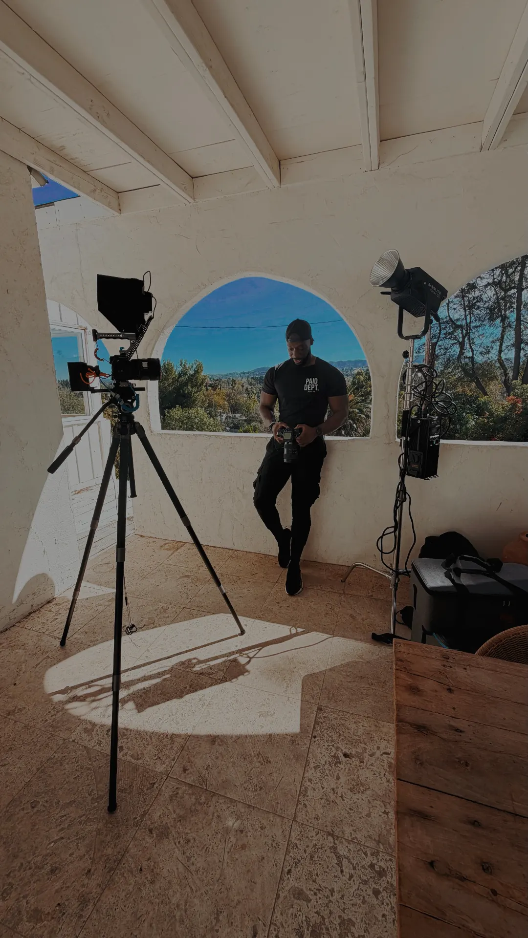 Ronald Wayne on set with camera and lighting rig